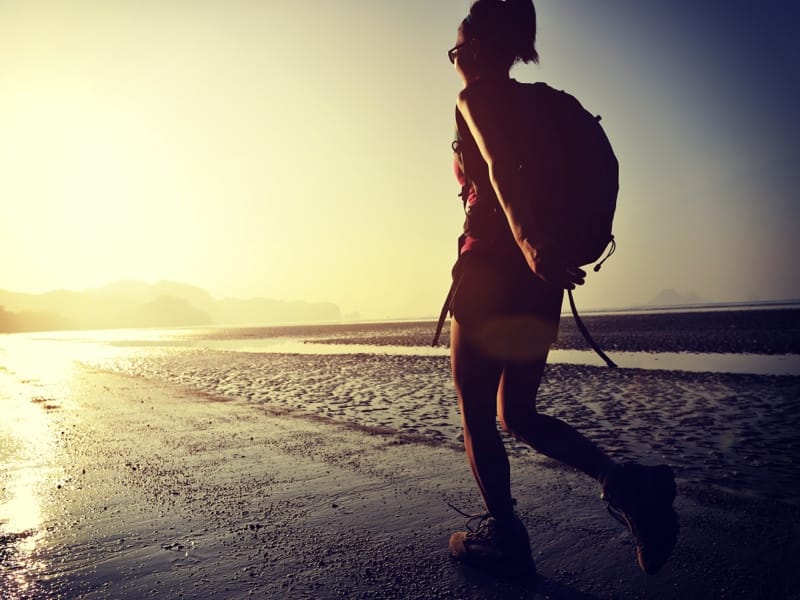 Woman exploring Palomino beaches at sunset | Colombia Travel