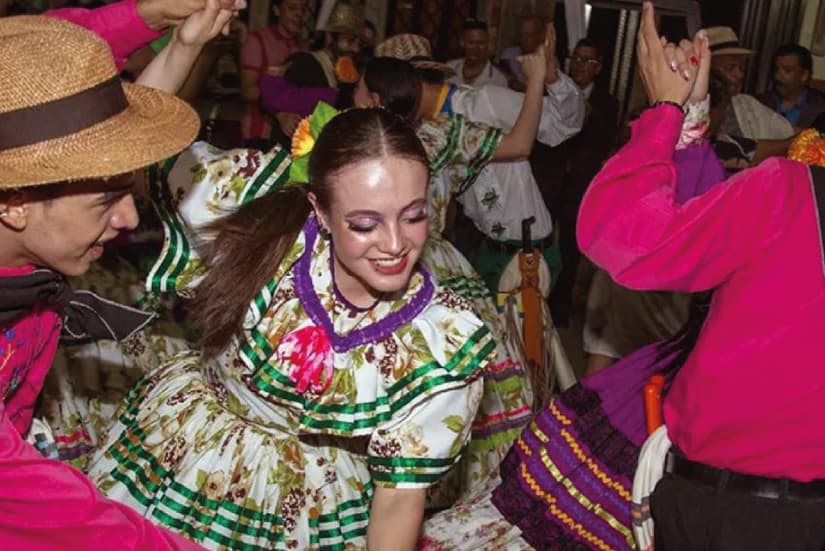 Couple dancing in traditional Colombian music costume