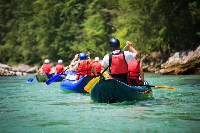Tourists rafting in the Colombian Amazon on a crystal-clear river