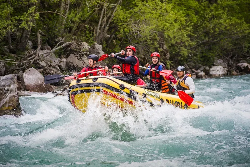 Tourist enjoying rafting in the Colombian Amazon on a clear but slightly fast river
