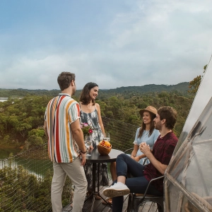 Friends enjoying glamping surrounded by a natural landscape – Colombia Travel