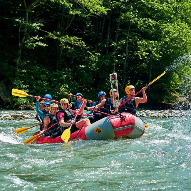 Rafting in the Amazon, a group of tourists raft on a crystal clear river