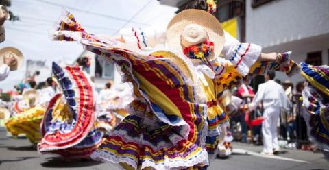 Woman dancing a traditional Colombian folk dance in traditional costume